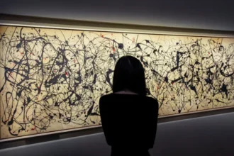 Jackson Pollock Painting Breaks Auction Record With 181 Million Dollar Sale Major Sale at Christie’s in New York Jackson Pollock’s artwork Number 7A 1948 has achieved a historic result at auction. Christie’s in New York sold the painting for 181 million dollars, which equals about 135 million pounds. The sale sets a new record for Pollock. It also places the work among the most expensive artworks ever sold at auction worldwide. A Key Piece From a Famous Collection The painting previously belonged to well known collector SI Newhouse. His private collection included several major modern art pieces. Auction experts confirmed that Number 7A 1948 has passed through some of the most important private collections over the past fifty years. Artwork Details and Style Pollock created this large canvas in his signature drip style. The painting stretches over three meters and features black paint drips with small touches of red. Art historians often describe this work as one of the earliest examples of fully abstract painting. Pollock helped shape the abstract expressionist movement before his death in 1956. Record Breaking Context The previous highest price for a Pollock painting was 61.2 million dollars for Number 17 1951, sold in 2021. This new result more than triples that figure. Christie’s also sold a bronze sculpture by Constantin Brancusi during the same event. That piece reached 107.6 million dollars, making it the second highest price ever paid for a sculpture at auction.
