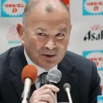 Eddie Jones Suspended as Japan Head Coach After Match Official Abuse Disciplinary Action Taken by JRFU Former England rugby head coach Eddie Jones has been fined and suspended from his role as Japan head coach after admitting to inappropriate comments directed at match officials during an under 23 tour in Australia last month. The Japanese Rugby Football Union confirmed the decision, saying the behaviour was serious enough to require strong disciplinary action under his contract. Jones has been removed from duty for six weeks and will miss Japan’s next four matches, including the opening Nations Championship fixture against Italy on 4 July. He will also be absent for two matches against a Hong Kong China Select team and a warm up game against the Maori All Blacks. The union has also reduced his salary as part of the punishment. Jones Issues Apology Jones accepted the sanction and expressed regret over his conduct. He said his remarks caused discomfort to local officials and others involved, and he apologised for the incident. The 66 year old acknowledged responsibility and said he understood the impact of his behaviour. Background and Recent Incidents Japan’s under 23 squad completed the tour with three wins from four matches, including a strong 38 to 21 victory over Randwick, a club closely linked to Jones’ coaching history. This is not the first time Jones has faced controversy since returning to Australia. After England’s series win over Australia in 2022, he was involved in tense exchanges with fans who accused him of disloyalty following his switch in coaching roles.