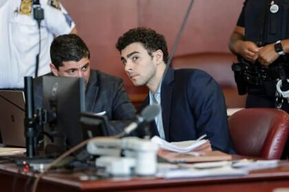Judge Rules Key Evidence Admissible in Luigi Mangione Murder Trial Court Decision on Evidence A New York judge has decided that some evidence collected after Luigi Mangione’s arrest can be used in his murder trial related to the killing of UnitedHealthcare CEO Brian Thompson in 2024. Judge Gregory Carro allowed prosecutors to present a gun and written materials found later at a police station. At the same time, he blocked several items taken during an early search at a Pennsylvania McDonald's. Items Excluded From Trial The judge ruled that some evidence must be suppressed because officers carried out an improper search without a warrant. The excluded items include a magazine, mobile phone, passport, wallet, and a computer chip. These were taken from Mangione’s backpack at the McDonald's restaurant in Altoona, Pennsylvania. The court also removed some statements made during the initial police questioning at the restaurant. These included questions about his identity and whether he carried false identification. Evidence Allowed in Court Other evidence will still be shown during the trial. This includes items recovered later at a police station after Mangione was taken into custody. Police found a handgun inside the backpack during a detailed search at the station. Officers also recorded a notebook during inventory processing. The judge said this later search followed proper procedure and did not violate legal protections. Arrest and Investigation Background Police in Altoona responded in December 2024 after receiving a tip about a man matching images of the suspected shooter. Officers found Mangione inside a McDonald's and questioned him. He was later read his rights after initial contact. During the first search of his bag, officers discovered several personal items. A more detailed search at the police station uncovered additional materials. Mangione was arrested days after the shooting of Brian Thompson in New York City following a nationwide search. He faces charges including second degree murder, stalking, and firearm related offenses. He has pleaded not guilty in both state and federal cases. Defence Argument Mangione’s legal team argued that police violated constitutional rights during the arrest. They said officers searched his belongings without a warrant and improperly questioned him. The court agreed with part of this argument and removed some of the disputed evidence from the trial record.