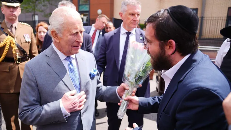 King Charles III visits Golders Green to meet victims of recent attacks, offering support to the Jewish community and raising concern about rising antisemitism.