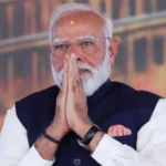 Modi Calls for Fuel Saving and Lifestyle Changes Amid Global Energy Pressure Rising Energy Costs Push Government Advisory Prime Minister Narendra Modi has asked people in India to change daily habits as global energy prices rise due to the ongoing conflict in the Middle East involving Iran. He encouraged citizens to work from home when possible and reduce unnecessary foreign travel. He also asked people to cut down on luxury spending and use resources more carefully. India imports most of its crude oil, so global supply shocks directly affect prices inside the country. The current crisis has increased import costs and put pressure on the national economy. Public Transport, Carpooling, and Lower Fuel Use Modi urged people to use public transport such as metro systems and buses instead of private vehicles. He also suggested carpooling to reduce fuel consumption. He said saving fuel is not only a personal benefit but also a national responsibility during this difficult time. Farmers were also advised to use fertilizers more carefully to manage supply shortages and rising costs in agriculture. Economic Pressure and Market Reaction The ongoing situation has already affected India’s economy. Fuel import costs have risen sharply, which has increased pressure on industries that rely heavily on energy and raw materials. Several sectors, including manufacturing and agriculture, are facing challenges. Some industries have warned of possible job losses if the situation continues. The Indian rupee has also weakened to record levels, making imports more expensive and adding pressure on inflation. Stock markets reacted quickly to the comments. The Sensex index dropped sharply in early trading as investors worried about longer economic disruption. Government Response and Political Debate So far, the government has avoided increasing petrol and diesel prices, even though state fuel companies face rising costs. Analysts believe the government may introduce stricter energy saving measures if the crisis continues. A fuel price revision is also being discussed in economic circles. Opposition leaders criticised the Prime Minister’s remarks. Rahul Gandhi said the government was shifting responsibility to citizens instead of addressing policy gaps. He argued that these statements reflect weak planning and lack of preparation for energy shocks.