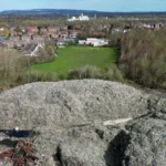 Major Waste Crime Sites Identified Authorities have published a new national watchlist highlighting illegal waste activity across England. The list includes 117 high priority sites linked to serious environmental concerns. Among them, 28 locations stand out as illegal waste super sites. Each of these contains more than 20,000 tonnes of dumped material. Officials estimate that around 700 illegal waste sites exist in total, but only the most urgent cases appear in the new list. The aim is to improve transparency and show where action is already underway. Largest Site Reaches 281,000 Tonnes The biggest site recorded is in Northwich, Cheshire. It holds about 281,000 tonnes of contaminated soil. This makes it the largest illegal waste site currently tracked. Investigations earlier this year had already identified similar large scale dumping issues in the same area. Other High Volume Locations Across England Several other major sites appear on the watchlist. These include locations in Wigan and Sheffield, which together hold close to 40,000 tonnes of waste. Additional large sites are spread across the country. Examples include Burnley, Retford, Scunthorpe, and St Austell, each holding between 50,000 and 99,000 tonnes. Other significant locations include areas in Suffolk, Essex, West Sussex, Cambridgeshire, and Worcestershire. One site in Pershore contains up to 199,000 tonnes of waste. Clean Up Work Already Underway Cleanup operations are already taking place at selected locations such as Hoads Wood in Kent and Kidlington in Oxfordshire. These sites were chosen because they pose serious environmental risks and affect nearby communities. Authorities confirm that cleanup decisions depend on strict risk based criteria set by the government. Funding Limits Slow Wider Action While some sites receive government funded cleanup support, many others remain without immediate action. Officials explain that limited funding restricts large scale removal work. As a result, only the most dangerous or high impact sites are prioritized. The Environment Agency continues to monitor all listed locations and respond where risks escalate.