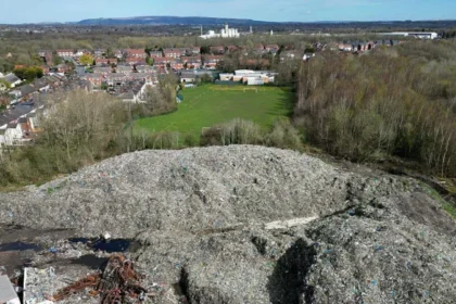 Major Waste Crime Sites Identified Authorities have published a new national watchlist highlighting illegal waste activity across England. The list includes 117 high priority sites linked to serious environmental concerns. Among them, 28 locations stand out as illegal waste super sites. Each of these contains more than 20,000 tonnes of dumped material. Officials estimate that around 700 illegal waste sites exist in total, but only the most urgent cases appear in the new list. The aim is to improve transparency and show where action is already underway. Largest Site Reaches 281,000 Tonnes The biggest site recorded is in Northwich, Cheshire. It holds about 281,000 tonnes of contaminated soil. This makes it the largest illegal waste site currently tracked. Investigations earlier this year had already identified similar large scale dumping issues in the same area. Other High Volume Locations Across England Several other major sites appear on the watchlist. These include locations in Wigan and Sheffield, which together hold close to 40,000 tonnes of waste. Additional large sites are spread across the country. Examples include Burnley, Retford, Scunthorpe, and St Austell, each holding between 50,000 and 99,000 tonnes. Other significant locations include areas in Suffolk, Essex, West Sussex, Cambridgeshire, and Worcestershire. One site in Pershore contains up to 199,000 tonnes of waste. Clean Up Work Already Underway Cleanup operations are already taking place at selected locations such as Hoads Wood in Kent and Kidlington in Oxfordshire. These sites were chosen because they pose serious environmental risks and affect nearby communities. Authorities confirm that cleanup decisions depend on strict risk based criteria set by the government. Funding Limits Slow Wider Action While some sites receive government funded cleanup support, many others remain without immediate action. Officials explain that limited funding restricts large scale removal work. As a result, only the most dangerous or high impact sites are prioritized. The Environment Agency continues to monitor all listed locations and respond where risks escalate.