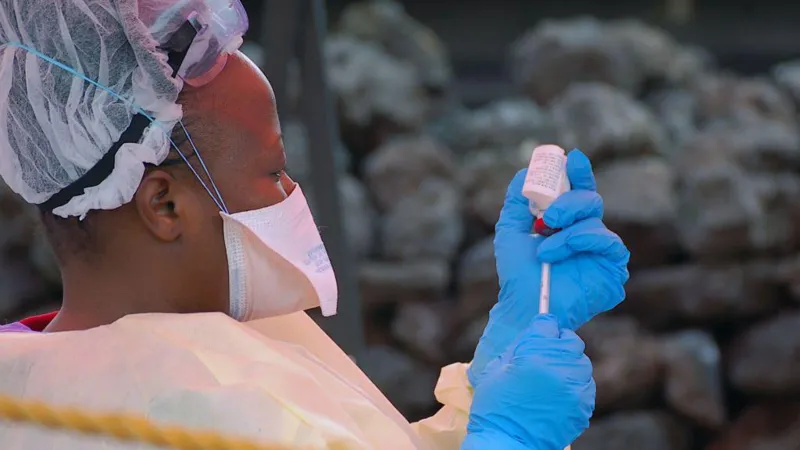 Ebola Outbreak in DR Congo Raises Concern Over Regional Spread Health authorities in the Democratic Republic of the Congo are closely monitoring a growing Ebola outbreak in the eastern part of the country. Early laboratory tests confirmed the virus in several samples collected from suspected patients. The Institut National de Recherche Biomédicale (INRB) in Kinshasa tested 20 samples and detected Ebola in 13 of them. Medical experts are now working to identify the exact strain of the virus. Officials reported 65 deaths linked to the outbreak. However, only four deaths have been confirmed through laboratory testing so far. Health teams continue to investigate other suspected cases in affected areas. Ebola Cases Confirmed in Eastern DR Congo The outbreak has mainly affected parts of Ituri province, including the provincial capital Bunia. Authorities also identified suspected infections in nearby communities. Laboratory teams are still checking samples from those areas. Health workers have increased monitoring efforts to prevent further transmission. Emergency teams are also tracing people who may have come into contact with infected patients. Health Officials Monitor Virus Strain Scientists are conducting more tests to determine the Ebola strain behind the outbreak. Identifying the strain will help medical teams improve response strategies and treatment planning. Health experts continue to study how quickly the virus spreads in the affected regions. Officials believe early detection remains critical for controlling the outbreak. Mining Towns Face Higher Risk Africa CDC warned that mining towns such as Mongwalu face a higher risk of transmission because of crowded conditions and frequent movement of workers. Urban areas like Bunia and Rwampara also remain vulnerable. Large populations and busy transport routes may increase the chances of the virus spreading further. Medical officials urged residents to follow safety guidelines issued by national health authorities. Communities have also received instructions on hygiene practices and reporting symptoms quickly. Regional Coordination Becomes Urgent Africa CDC Executive Director Jean Kaseya said cross border coordination is necessary because many people regularly travel between affected areas and neighboring countries. Health authorities from nearby nations are now discussing emergency response plans and surveillance measures. Officials want to strengthen border monitoring and improve communication between regional health agencies. The Congolese government has not officially declared a national outbreak yet. Authorities are expected to provide more updates as investigations continue and additional test results become available.