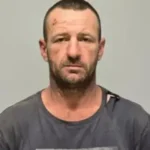 Body Found Believed to Be Fugitive Australian Shooter in New South Wales Discovery Near Rural Area in New South Wales Police in New South Wales say a body has been found that is believed to be Julian Ingram, a man wanted for a deadly shooting incident earlier this year. The remains were located about 50 kilometers from the scene of the original crime near a remote area north west of the town linked to the case. Wildlife officers found the body beside an abandoned utility vehicle while carrying out pest control work. Authorities later confirmed that the vehicle matched the one used by Ingram during his escape. Connection to January Shooting Incident In January, Ingram was accused of killing three people in a small rural town. The victims included his former partner Sophie Quinn, her close friend, and her aunt. Quinn was seven months pregnant at the time of her death and was expecting a baby in March. Another victim survived the attack but suffered serious injuries. Police later confirmed that the injured person has since been discharged from hospital. Large Scale Police Search Operation After the killings, police launched a major search operation involving around 100 officers. Authorities described Ingram as someone with strong local knowledge, which made the search more difficult. Officials believed he could remain hidden in the region for a long period without being detected. The area where the incident occurred is sparsely populated, with only around 1,500 residents. Police Statement on the Discovery Assistant Commissioner Andrew Holland said early findings suggest the body is likely that of Ingram. He noted that clothing and identification found at the scene support this conclusion. Police also confirmed that the remains appear to have been at the location for an extended period before discovery. Holland added that the finding brings relief to the investigation and may help the local community move forward after the violent events. Investigation Status Authorities are continuing formal identification procedures. However, police say early evidence strongly suggests the search for the suspect has ended with the discovery of his body.