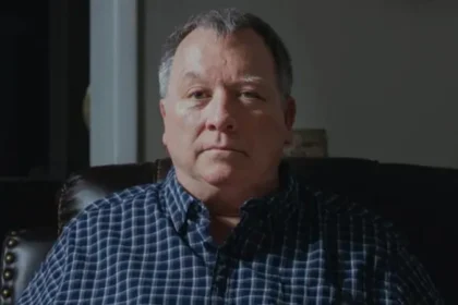 Retired Officer Wins 835000 Dollar Settlement After Jail Time Over Facebook Post Case Overview A retired police officer from Tennessee has reached a settlement of 835000 dollars in a lawsuit over unlawful incarceration. He spent 37 days in jail after being arrested over a Facebook post related to the killing of Charlie Kirk. Authorities later dropped the felony charges against him. The case has drawn attention because of its connection to free speech and social media expression. What Led to the Arrest The man, Larry Bushart, shared a meme in a Facebook discussion about a vigil held for Charlie Kirk. The post appeared about 10 days after Kirk was killed at a speaking event in Utah. The meme included the line, “Seems relevant today,” along with a partial quote from a message by Donald Trump that referenced moving on after a school shooting tragedy. Police later arrested him at his home. Officials said the post was treated as a threat linked to mass violence at a school due to confusion over the school name mentioned in the context. Jail Time and Personal Impact Bushart was held in custody because he could not pay a 2 million dollar bond. He remained in jail for 37 days before charges were dismissed. During this time, he lost his post retirement job and missed the birth of his grandchild. His legal complaint focused on unlawful incarceration and violations tied to free speech protections. Settlement and Statement Bushart filed a lawsuit against Perry County, the local sheriff, and an investigator involved in the case. After reaching a settlement of 835000 dollars, he said his First Amendment rights were upheld. He also said public participation in civil discussion is important for a healthy democracy and that he plans to focus on family life moving forward.