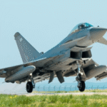 Russian Fighter Jets Intercept RAF Spy Aircraft Over Black Sea Incident Overview Two Russian fighter jets approached a British Royal Air Force surveillance aircraft during a mission over the Black Sea. The RAF aircraft was unarmed and operating in international airspace while carrying out routine intelligence work to support NATO operations. Officials reported that the encounter involved unsafe flying behavior that created a high risk of collision and escalation. Dangerous Close Approaches by Russian Jets A Russian Su 35 fighter moved very close to the RAF Rivet Joint aircraft. The approach was so near that it triggered emergency systems on the British plane and disrupted its automated control system. In a separate action, a Russian Su 27 jet carried out six repeated passes in front of the RAF aircraft. At one point, it came within around six meters of the aircraft nose, which raised serious safety concerns for the crew. Response From UK Defence Officials The UK Defence Secretary praised the RAF crew for staying calm and handling the situation professionally under pressure. He stated that the actions of the Russian pilots were unsafe and unacceptable. Officials stressed that the incident increased the risk of accidental conflict in an already tense region. They also confirmed that the aircraft was on a standard mission to support NATO monitoring activities along its eastern area. Growing Tensions in the Region Authorities highlighted that this is part of a wider pattern of increased military activity in the region. Concerns have also been raised about Russian naval and submarine movements near critical infrastructure in nearby waters. The Ministry of Defence noted that similar incidents have happened before, including a serious encounter in 2022 involving a missile fired near a British surveillance aircraft over the same region. About the RAF Rivet Joint Aircraft The RAF Rivet Joint is a surveillance aircraft used to collect electronic signals and intelligence. It helps track communication signals and supports military planning by providing situational awareness to allied forces. It is operated by a specialist RAF squadron based in the United Kingdom and is often deployed for monitoring missions near sensitive regions.