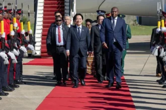 Taiwan President Visits Eswatini Despite China Travel Pressure Taiwan’s President Lai Ching-te has arrived in Eswatini, just days after his government said a planned trip faced disruption. Officials claimed China pressured several African nations to block his transit through their airspace. Despite these hurdles, Lai confirmed that his team managed the visit through careful planning. He did not share specific details about how he reached Eswatini but praised the efforts of his diplomatic and security teams. Only African Ally Strengthens Ties Eswatini remains Taiwan’s only diplomatic ally in Africa. The visit highlights the strong relationship between the two nations. Prime Minister Russell Dlamini welcomed Lai with a formal ceremony, including a guard of honour. Taiwan’s delegation included Foreign Minister Lin Chia-lung and National Security Council adviser Alex Huang. This visit continues a pattern of engagement between the two countries. Previous Taiwanese leaders have also visited Eswatini to maintain diplomatic ties. China Criticizes the Visit China strongly reacted to the trip. Officials described Lai’s visit as a “stowaway-style escape farce.” Beijing continues to claim Taiwan as part of its territory and rejects any official international engagement by Taiwanese leaders. China often pressures countries to limit or cut ties with Taiwan. This has reduced Taiwan’s diplomatic allies in recent years. United States Calls Visit Routine The United States responded by downplaying the situation. A State Department spokesperson said the visit was routine and should not become politicized. The spokesperson added that every democratically elected Taiwanese president travels abroad to meet allies. Former President Tsai Ing-wen visited Eswatini in both 2018 and 2023. The US also highlighted Taiwan’s global role. It described Taiwan as a reliable partner that brings economic and social benefits to countries like Eswatini. Rising Tensions in Global Diplomacy This visit reflects ongoing tensions between Taiwan and China. While Taiwan seeks to strengthen its global partnerships, China continues efforts to isolate it diplomatically. Lai’s successful visit shows that Taiwan is still able to maintain and grow key alliances despite external pressure.