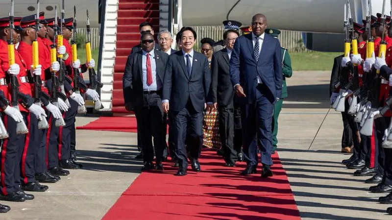 Taiwan President Visits Eswatini Despite China Travel Pressure Taiwan’s President Lai Ching-te has arrived in Eswatini, just days after his government said a planned trip faced disruption. Officials claimed China pressured several African nations to block his transit through their airspace. Despite these hurdles, Lai confirmed that his team managed the visit through careful planning. He did not share specific details about how he reached Eswatini but praised the efforts of his diplomatic and security teams. Only African Ally Strengthens Ties Eswatini remains Taiwan’s only diplomatic ally in Africa. The visit highlights the strong relationship between the two nations. Prime Minister Russell Dlamini welcomed Lai with a formal ceremony, including a guard of honour. Taiwan’s delegation included Foreign Minister Lin Chia-lung and National Security Council adviser Alex Huang. This visit continues a pattern of engagement between the two countries. Previous Taiwanese leaders have also visited Eswatini to maintain diplomatic ties. China Criticizes the Visit China strongly reacted to the trip. Officials described Lai’s visit as a “stowaway-style escape farce.” Beijing continues to claim Taiwan as part of its territory and rejects any official international engagement by Taiwanese leaders. China often pressures countries to limit or cut ties with Taiwan. This has reduced Taiwan’s diplomatic allies in recent years. United States Calls Visit Routine The United States responded by downplaying the situation. A State Department spokesperson said the visit was routine and should not become politicized. The spokesperson added that every democratically elected Taiwanese president travels abroad to meet allies. Former President Tsai Ing-wen visited Eswatini in both 2018 and 2023. The US also highlighted Taiwan’s global role. It described Taiwan as a reliable partner that brings economic and social benefits to countries like Eswatini. Rising Tensions in Global Diplomacy This visit reflects ongoing tensions between Taiwan and China. While Taiwan seeks to strengthen its global partnerships, China continues efforts to isolate it diplomatically. Lai’s successful visit shows that Taiwan is still able to maintain and grow key alliances despite external pressure.