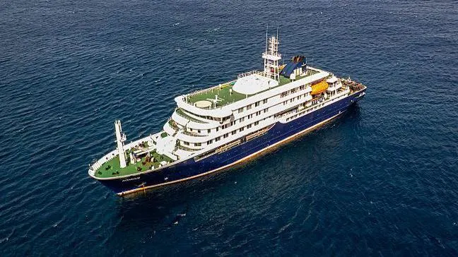 Hantavirus Outbreak Reported on Atlantic Cruise Ship Incident Overview Health authorities have reported a serious hantavirus situation on a cruise ship sailing across the Atlantic Ocean. The vessel, MV Hondius operated by Oceanwide Expeditions, was traveling from Argentina toward Cape Verde when multiple passengers fell ill. Three people have died during the incident. A Dutch married couple and a German passenger were among the deceased. Officials have confirmed two hantavirus cases so far, including a Dutch woman who later died after leaving the ship. Investigations continue to determine the exact cause of the remaining deaths. Two crew members also developed breathing related symptoms while on board. One showed mild illness and the other required urgent medical attention. What Is Hantavirus Hantavirus refers to a group of viruses carried mainly by rodents. Humans usually become infected when they breathe in particles contaminated with rodent urine, droppings, or saliva. This virus does not typically spread from person to person. Infection usually happens in environments where rodent activity is present and contaminated dust becomes airborne. People may also get infected through rodent bites or scratches, but this is less common. How the Virus Spreads The main transmission route involves inhalation of infected particles in the air. When dried rodent waste is disturbed, it can release virus particles into the environment. Risk increases in enclosed or poorly cleaned areas where rodents live or have lived. Travel environments, storage areas, or remote locations can increase exposure risk if rodent control is weak. Symptoms and Health Risks Hantavirus Pulmonary Syndrome This form affects the lungs. Early signs include fever, fatigue, and muscle pain. As the illness progresses, patients may experience headaches, dizziness, chills, and stomach discomfort. Breathing problems can develop suddenly. In severe cases, the condition becomes life threatening. Health data shows a high death rate once respiratory symptoms begin. Hemorrhagic Fever with Kidney Complications This form affects the kidneys and blood vessels. Symptoms may include low blood pressure, bleeding inside the body, and kidney failure. It can become severe without fast medical care. Current Cases Under Investigation A 69 year old British passenger is currently in intensive care in South Africa and has tested positive for hantavirus. The Dutch woman who died after leaving the ship also tested positive. Health officials are still testing crew members who showed respiratory symptoms. Results have not yet confirmed whether they are infected with the virus.