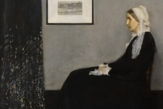 Whistler’s Mother: Why a Quiet Portrait Became a Global Icon A painting that was never meant to be famous “Whistler’s Mother” is one of the most recognized artworks in the world today. The painting’s real title is Arrangement in Grey and Black: Portrait of the Painter’s Mother (1871). It is now being shown at Tate Britain as part of a major exhibition on James Abbott McNeill Whistler. The portrait shows Whistler’s mother seated in a simple, calm pose. At the time it was created, no one expected it to become a cultural icon. An unexpected beginning The painting came together by chance. In late 1871, Whistler’s usual model could not attend a sitting due to illness. His mother, Anna McNeill Whistler, stepped in reluctantly. She later reflected on the moment and saw it as meaningful, writing that disappointments can sometimes lead to good outcomes. Whistler was living in London at the time and working steadily as an artist. The portrait was not planned as a major work. It was one of many pieces he created during that period. Near destruction and early rejection The painting almost did not survive its early years. It was nearly destroyed in a train fire in 1871. Later, it also faced rejection risks from the Royal Academy exhibition in 1872. It only made it into the show after support from Whistler’s friend Sir William Boxall. Even after it was displayed, public reaction was weak. Critics and viewers did not respond with enthusiasm. The work had a difficult start in the art world. Why critics did not understand it At the time, Victorian audiences preferred clear stories in art. They liked paintings based on history, mythology, or literature. Whistler worked differently. He used simple titles like “harmony,” “nocturne,” and “symphony.” These did not explain the subject clearly, which confused many viewers. Because of this, his work often faced criticism. People expected storytelling, but Whistler focused more on mood, form, and arrangement. From rejection to global fame Despite early criticism, Whistler’s Mother slowly gained recognition. Over time, it became one of the most reproduced artworks in modern culture. It has appeared in cartoons like Donald Duck, TV shows such as The Simpsons, and even in literary references like Nabokov’s Lolita. Its image moved far beyond the art world and entered popular culture. What once seemed like a simple portrait became a symbol of calm, discipline, and tradition. Why Whistler might not have liked its success Whistler often resisted how the public interpreted his work. He focused on artistic balance and composition rather than meaning or storytelling. The massive fame of this single painting likely frustrated him. It overshadowed much of his wider body of work, which he considered more important.