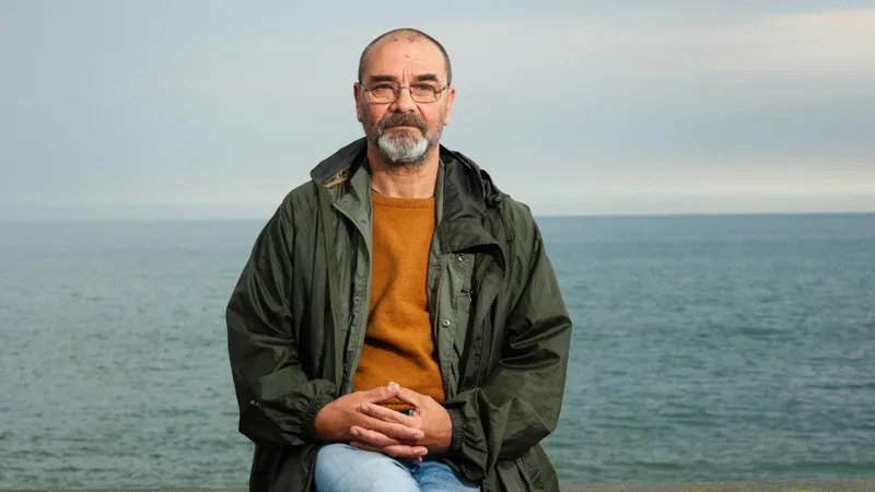 Andrew Malkinson Says Legal Fee Demand After Wrongful Conviction Feels “Vindictive” Andrew Malkinson Criticises Compensation Process Andrew Malkinson has urged the UK government to step in after being asked to cover legal costs from the compensation awarded for his wrongful rape conviction. He said the decision feels unfair after spending nearly two decades behind bars for a crime he did not commit. Malkinson explained that officials may deduct legal fees and expert costs from his compensation payment. According to him, the amount could reach up to £10,000. He described the move as “penny pinching” and questioned why the state was not covering the expenses. For more than 20 years, Malkinson lived under the shadow of a conviction linked to a brutal 2003 attack in Greater Manchester. He served over 17 years in prison before his conviction was overturned in one of the UK’s most serious miscarriages of justice. “The State Caused the Damage,” Says Malkinson Speaking about the issue, Malkinson said the government should accept responsibility for the costs connected to the case. He argued that the authorities caused the injustice, so they should also pay the legal and expert fees required to clear his name. He also called on Justice Secretary David Lammy to resolve the issue quickly. Malkinson said the matter could be fixed immediately if the government chose to act. The Ministry of Justice responded by saying the miscarriage of justice compensation scheme exists to help people rebuild their lives. Officials added that the maximum compensation amount increased by 30% last year to £1.3 million. The department also confirmed that the Law Commission is reviewing rules related to criminal appeals and compensation cases. Authorities said they would carefully study the findings once the consultation process ends. Real Attacker Convicted After Years of Suffering Malkinson spoke publicly after the conviction of 52 year old Paul Quinn, who was recently found guilty of rape, strangulation, and grievous bodily harm connected to the same attack. Although relieved that the real offender had finally been convicted, Malkinson admitted the case still brought strong emotions. He said anger returned because he carried the blame and punishment for many years despite no DNA evidence linking him to the crime. At the time Quinn was convicted, Malkinson was visiting ancient ruins in Rome, Italy. He reflected on the years of suffering experienced by both himself and the victim. He also said he often wondered how the victim must feel after the truth finally came out. Malkinson stressed that he spent years serving “somebody else’s punishment.” His case continues to raise serious questions about the justice system and the long term impact of wrongful convictions.