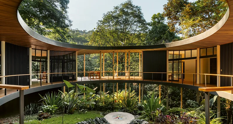 Explore unique summer homes designed to blend with nature, from Costa Rica rainforests to Greece, showcasing sustainable architecture and natural living spaces.