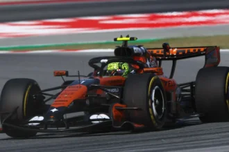 # Norris Encouraged as McLaren Returns to the Front in Barcelona Lando Norris believes McLaren is moving in the right direction after the team delivered a strong performance during Friday practice at the Barcelona Catalunya Grand Prix. The British driver set the fastest lap of the day, finishing just 0.009 seconds ahead of Mercedes driver George Russell. McLaren teammate Oscar Piastri also impressed by taking third place, only 0.057 seconds behind Norris. ## McLaren Finds Speed Again in Barcelona McLaren arrived in Spain looking for answers after disappointing weekends in Monaco and Canada. The team struggled for pace at both events, and Norris failed to finish either race. However, the opening practice sessions in Barcelona painted a much more positive picture. Norris said the circuit suited the car better and allowed the team to operate in a stronger performance window. He explained that Barcelona's layout is very different from Monaco and Canada. The improved balance gave the team more confidence and helped unlock better speed throughout the day. Although Norris was pleased with the result, he admitted there is still work to do before qualifying and the race. ## Mercedes Staying Close to McLaren Mercedes also looked competitive. Russell finished second and remained within touching distance of Norris. Rookie championship leader Kimi Antonelli ended the session in fifth place. He missed the first practice session after Mercedes handed reserve driver Frederik Vesti valuable track time. Antonelli said tyre management remained a challenge because the hot conditions caused overheating. Despite that, he felt positive about the team's long run pace and expected further improvements on Saturday. Mercedes deputy team principal Bradley Lord praised both drivers and noted that the battle at the front appears extremely close. He also highlighted Ferrari's strong race pace during longer runs. ## Ferrari Showing Strong Long Run Pace Charles Leclerc finished fourth fastest and continued to show encouraging pace for Ferrari. Data from the longer race simulations suggested Ferrari could be a serious threat during Sunday's race. Leclerc's performance on medium tyres compared favorably with Mercedes and McLaren. Lewis Hamilton, however, experienced a more difficult session. After missing the opening practice due to Ferrari's junior driver program, he finished ninth on the timesheets and struggled to find consistent speed. ## Verstappen Faces Difficult Start Red Bull endured a frustrating Friday as Max Verstappen finished sixth, almost nine tenths of a second behind Norris. The Dutch driver reported grip problems in every type of corner. He said the car lacked balance and failed to provide the confidence needed to attack the circuit. Verstappen admitted Red Bull is currently not in a position to challenge McLaren and Mercedes at the front. He also noted that changing track conditions and strong winds made the situation even more difficult. ## Tight Battle Expected This Weekend Friday's practice sessions suggest McLaren has taken an important step forward after recent setbacks. Norris and Piastri both looked competitive, while Mercedes and Ferrari remain close contenders. Although race pace data produced mixed results, McLaren appears far stronger than it did in Monaco and Canada. With qualifying still to come, fans can expect a closely fought battle between several teams at the front of the grid.