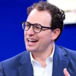 Anthropic Moves Toward US IPO as AI Market Approaches Record Valuations Anthropic Prepares for Public Listing in the US Artificial intelligence company Anthropic has started the process of going public in the United States. The firm, known for its chatbot Claude, has filed paperwork with US regulators to begin an initial public offering. The company has not confirmed the share price or how many shares will be offered yet. Anthropic was founded just five years ago and has quickly grown into one of the leading AI companies in the world. Recent private funding placed its valuation above $965 billion, putting it close to the trillion-dollar mark. AI Valuations Push Toward Historic Levels The planned IPO comes at a time when investor interest in artificial intelligence is extremely high. Anthropic is now competing directly with other major players such as OpenAI and SpaceX in attracting large scale investment. OpenAI is also considering a public listing. Its most recent valuation stands at around $852 billion, slightly below Anthropic’s latest private estimate. SpaceX is also preparing for a possible stock market debut that could reshape investor expectations for technology companies. Alphabet, the parent company of Google, has also announced plans to raise about $80 billion to expand its AI investments. This shows how strongly major tech firms are competing in the AI space. Competition Between Anthropic and OpenAI Intensifies Anthropic was founded by Dario Amodei after he left OpenAI due to strategic disagreements with its leadership. Since then, both companies have developed advanced AI systems and now compete for users, enterprise customers, and investor funding. OpenAI chief executive Sam Altman has stated that his company will go public when the timing is right, but there is no urgency. Both firms are now seen as key players in the race to dominate generative AI. Investor Debate on Timing and Market Risk Market analysts are closely watching how and when these companies choose to list. Some experts believe Anthropic could help set new standards for valuing AI businesses, especially around revenue, subscribers, and enterprise adoption. Others argue that being first to market may be an advantage, as it allows a company to shape investor expectations. If a company delays too long, it may lose that influence. Investors are also interested in Anthropic’s financial performance, especially profitability, which will be closely studied once official IPO documents are released. AI Industry Enters Capital Intensive Phase Experts say the AI sector is entering a phase that requires massive investment. Companies are spending heavily on infrastructure, research, and model development. This capital demand is driving the push toward public markets. If Anthropic, OpenAI, and SpaceX all go public, it could create one of the largest technology investment waves in stock market history.