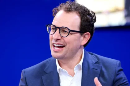 Anthropic Moves Toward US IPO as AI Market Approaches Record Valuations Anthropic Prepares for Public Listing in the US Artificial intelligence company Anthropic has started the process of going public in the United States. The firm, known for its chatbot Claude, has filed paperwork with US regulators to begin an initial public offering. The company has not confirmed the share price or how many shares will be offered yet. Anthropic was founded just five years ago and has quickly grown into one of the leading AI companies in the world. Recent private funding placed its valuation above $965 billion, putting it close to the trillion-dollar mark. AI Valuations Push Toward Historic Levels The planned IPO comes at a time when investor interest in artificial intelligence is extremely high. Anthropic is now competing directly with other major players such as OpenAI and SpaceX in attracting large scale investment. OpenAI is also considering a public listing. Its most recent valuation stands at around $852 billion, slightly below Anthropic’s latest private estimate. SpaceX is also preparing for a possible stock market debut that could reshape investor expectations for technology companies. Alphabet, the parent company of Google, has also announced plans to raise about $80 billion to expand its AI investments. This shows how strongly major tech firms are competing in the AI space. Competition Between Anthropic and OpenAI Intensifies Anthropic was founded by Dario Amodei after he left OpenAI due to strategic disagreements with its leadership. Since then, both companies have developed advanced AI systems and now compete for users, enterprise customers, and investor funding. OpenAI chief executive Sam Altman has stated that his company will go public when the timing is right, but there is no urgency. Both firms are now seen as key players in the race to dominate generative AI. Investor Debate on Timing and Market Risk Market analysts are closely watching how and when these companies choose to list. Some experts believe Anthropic could help set new standards for valuing AI businesses, especially around revenue, subscribers, and enterprise adoption. Others argue that being first to market may be an advantage, as it allows a company to shape investor expectations. If a company delays too long, it may lose that influence. Investors are also interested in Anthropic’s financial performance, especially profitability, which will be closely studied once official IPO documents are released. AI Industry Enters Capital Intensive Phase Experts say the AI sector is entering a phase that requires massive investment. Companies are spending heavily on infrastructure, research, and model development. This capital demand is driving the push toward public markets. If Anthropic, OpenAI, and SpaceX all go public, it could create one of the largest technology investment waves in stock market history.