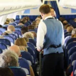 # UK Government Considers National Airline Blacklist for Disruptive Passengers The UK government is exploring plans to create a national airline blacklist that could stop abusive and disruptive passengers from flying with any UK carrier. The proposal aims to improve passenger safety and support airline staff by preventing repeat offenders from switching airlines after receiving a ban from one company. Officials from the Department for Transport are expected to meet with airline representatives this month to discuss how the system could work. ## Why the New Proposal Is Being Considered Airlines often face challenges with disruptive travelers, especially during the busy summer holiday season. Incidents involving aggressive behavior, intoxication, and verbal abuse can put passengers and crew members at risk. Currently, when an airline bans a passenger for misconduct, that individual can often book a flight with another carrier. The proposed national database would help airlines share information and take coordinated action against repeat offenders. Government officials believe stronger cooperation between airlines could reduce onboard disturbances and create a safer travel environment for everyone. ## Safety Concerns Continue to Grow Disruptive behavior on flights remains a serious issue across the aviation industry. Airline crews regularly deal with passengers who become aggressive, intoxicated, or refuse to follow safety instructions. Such incidents can delay flights, force emergency landings, and create unnecessary stress for travelers. In severe cases, airlines and authorities pursue criminal charges against offenders. The government says it wants to ensure passengers can travel safely without facing disturbances caused by a small number of individuals. ## Recent Cases Highlight the Problem Several high profile incidents have brought attention to the issue. In one case, a passenger became so abusive during a flight from Krakow to Bristol that the pilot had to abandon the aircraft's first landing attempt. The passenger later received a prison sentence. Another incident involved a fight between two passengers on a flight traveling from Turkey to Manchester. The confrontation forced the aircraft to make an emergency landing in Brussels, where authorities arrested those involved. The airline later imposed lifetime bans on both passengers. These cases demonstrate the significant impact disruptive behavior can have on flight operations and passenger safety. ## Airlines Support Stronger Measures Many airlines have welcomed the proposal. Industry leaders argue that a national blacklist would strengthen existing efforts to tackle disruptive conduct. Airlines already enforce strict policies and issue lifetime bans in serious cases. However, they believe a shared database would make these penalties more effective by preventing offenders from simply choosing another carrier. The aviation industry hopes the proposed system will discourage poor behavior and help create a safer experience for passengers and crew members alike. ## Data Protection Challenges Remain While the proposal has gained support, questions remain about data protection and privacy regulations. Current GDPR rules limit how airlines can share passenger information. Government officials and industry representatives will need to determine how a national database could operate while complying with existing privacy laws. Further discussions are expected as the government and airlines explore practical solutions. ## What Happens Next? The Department for Transport will continue discussions with airlines in the coming weeks. If approved, the scheme could become a major step toward reducing disruptive behavior on flights and improving safety across the UK's aviation sector. For now, airlines and government officials remain focused on finding a solution that protects passengers, supports crew members, and maintains compliance with data protection regulations.