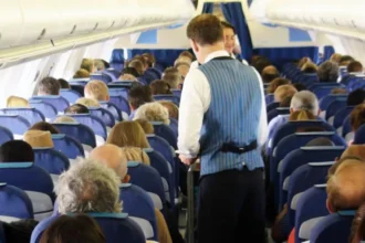 # UK Government Considers National Airline Blacklist for Disruptive Passengers The UK government is exploring plans to create a national airline blacklist that could stop abusive and disruptive passengers from flying with any UK carrier. The proposal aims to improve passenger safety and support airline staff by preventing repeat offenders from switching airlines after receiving a ban from one company. Officials from the Department for Transport are expected to meet with airline representatives this month to discuss how the system could work. ## Why the New Proposal Is Being Considered Airlines often face challenges with disruptive travelers, especially during the busy summer holiday season. Incidents involving aggressive behavior, intoxication, and verbal abuse can put passengers and crew members at risk. Currently, when an airline bans a passenger for misconduct, that individual can often book a flight with another carrier. The proposed national database would help airlines share information and take coordinated action against repeat offenders. Government officials believe stronger cooperation between airlines could reduce onboard disturbances and create a safer travel environment for everyone. ## Safety Concerns Continue to Grow Disruptive behavior on flights remains a serious issue across the aviation industry. Airline crews regularly deal with passengers who become aggressive, intoxicated, or refuse to follow safety instructions. Such incidents can delay flights, force emergency landings, and create unnecessary stress for travelers. In severe cases, airlines and authorities pursue criminal charges against offenders. The government says it wants to ensure passengers can travel safely without facing disturbances caused by a small number of individuals. ## Recent Cases Highlight the Problem Several high profile incidents have brought attention to the issue. In one case, a passenger became so abusive during a flight from Krakow to Bristol that the pilot had to abandon the aircraft's first landing attempt. The passenger later received a prison sentence. Another incident involved a fight between two passengers on a flight traveling from Turkey to Manchester. The confrontation forced the aircraft to make an emergency landing in Brussels, where authorities arrested those involved. The airline later imposed lifetime bans on both passengers. These cases demonstrate the significant impact disruptive behavior can have on flight operations and passenger safety. ## Airlines Support Stronger Measures Many airlines have welcomed the proposal. Industry leaders argue that a national blacklist would strengthen existing efforts to tackle disruptive conduct. Airlines already enforce strict policies and issue lifetime bans in serious cases. However, they believe a shared database would make these penalties more effective by preventing offenders from simply choosing another carrier. The aviation industry hopes the proposed system will discourage poor behavior and help create a safer experience for passengers and crew members alike. ## Data Protection Challenges Remain While the proposal has gained support, questions remain about data protection and privacy regulations. Current GDPR rules limit how airlines can share passenger information. Government officials and industry representatives will need to determine how a national database could operate while complying with existing privacy laws. Further discussions are expected as the government and airlines explore practical solutions. ## What Happens Next? The Department for Transport will continue discussions with airlines in the coming weeks. If approved, the scheme could become a major step toward reducing disruptive behavior on flights and improving safety across the UK's aviation sector. For now, airlines and government officials remain focused on finding a solution that protects passengers, supports crew members, and maintains compliance with data protection regulations.