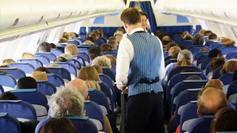 # UK Government Considers National Airline Blacklist for Disruptive Passengers The UK government is exploring plans to create a national airline blacklist that could stop abusive and disruptive passengers from flying with any UK carrier. The proposal aims to improve passenger safety and support airline staff by preventing repeat offenders from switching airlines after receiving a ban from one company. Officials from the Department for Transport are expected to meet with airline representatives this month to discuss how the system could work. ## Why the New Proposal Is Being Considered Airlines often face challenges with disruptive travelers, especially during the busy summer holiday season. Incidents involving aggressive behavior, intoxication, and verbal abuse can put passengers and crew members at risk. Currently, when an airline bans a passenger for misconduct, that individual can often book a flight with another carrier. The proposed national database would help airlines share information and take coordinated action against repeat offenders. Government officials believe stronger cooperation between airlines could reduce onboard disturbances and create a safer travel environment for everyone. ## Safety Concerns Continue to Grow Disruptive behavior on flights remains a serious issue across the aviation industry. Airline crews regularly deal with passengers who become aggressive, intoxicated, or refuse to follow safety instructions. Such incidents can delay flights, force emergency landings, and create unnecessary stress for travelers. In severe cases, airlines and authorities pursue criminal charges against offenders. The government says it wants to ensure passengers can travel safely without facing disturbances caused by a small number of individuals. ## Recent Cases Highlight the Problem Several high profile incidents have brought attention to the issue. In one case, a passenger became so abusive during a flight from Krakow to Bristol that the pilot had to abandon the aircraft's first landing attempt. The passenger later received a prison sentence. Another incident involved a fight between two passengers on a flight traveling from Turkey to Manchester. The confrontation forced the aircraft to make an emergency landing in Brussels, where authorities arrested those involved. The airline later imposed lifetime bans on both passengers. These cases demonstrate the significant impact disruptive behavior can have on flight operations and passenger safety. ## Airlines Support Stronger Measures Many airlines have welcomed the proposal. Industry leaders argue that a national blacklist would strengthen existing efforts to tackle disruptive conduct. Airlines already enforce strict policies and issue lifetime bans in serious cases. However, they believe a shared database would make these penalties more effective by preventing offenders from simply choosing another carrier. The aviation industry hopes the proposed system will discourage poor behavior and help create a safer experience for passengers and crew members alike. ## Data Protection Challenges Remain While the proposal has gained support, questions remain about data protection and privacy regulations. Current GDPR rules limit how airlines can share passenger information. Government officials and industry representatives will need to determine how a national database could operate while complying with existing privacy laws. Further discussions are expected as the government and airlines explore practical solutions. ## What Happens Next? The Department for Transport will continue discussions with airlines in the coming weeks. If approved, the scheme could become a major step toward reducing disruptive behavior on flights and improving safety across the UK's aviation sector. For now, airlines and government officials remain focused on finding a solution that protects passengers, supports crew members, and maintains compliance with data protection regulations.