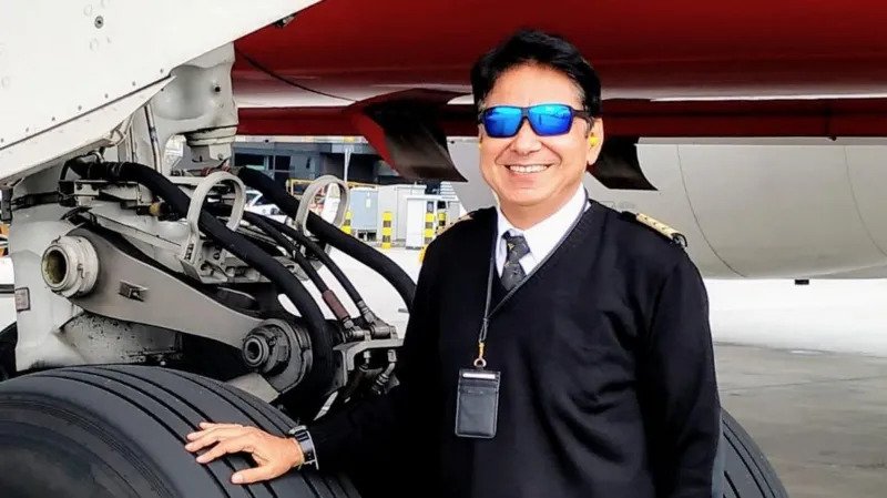 ## Air India Crash Pilot’s Father Vows to Defend Son’s Reputation The father of Capt Sumeet Sabharwal, one of the pilots who died in the Air India Flight 171 crash, has promised to continue defending his son's reputation as investigators prepare to release another update on the tragedy. Pushkar Raj Sabharwal said he remains determined to protect his son's name from speculation and unverified claims. "My son is no longer here, but I must defend his reputation," he said. ## Family Faces Painful Speculation Capt Sumeet Sabharwal served as the senior pilot on Air India Flight 171. The London-bound Boeing 787 Dreamliner crashed just seconds after taking off from Ahmedabad on June 12, 2025. The disaster claimed at least 260 lives, including 241 passengers and crew members on board. It became one of India's deadliest aviation accidents in recent years. Since the crash, the Sabharwal family has faced intense public attention. Media reports and online discussions have added to their grief while the investigation remains unfinished. ## Investigation Continues Without Final Conclusion Authorities have not yet determined the exact cause of the crash. A preliminary investigation report revealed that the fuel control switches for both engines moved from the "run" position to the "cut-off" position shortly after take-off. As a result, both engines lost fuel supply during a critical stage of the flight. Cockpit recordings captured a conversation between the two pilots. One pilot questioned why the fuel had been cut off, while the other denied taking that action. Investigators did not identify which pilot made either statement. They also found no evidence that either pilot intentionally caused the incident. ## Reports Shifted Attention Toward Senior Pilot Several international media reports later suggested that investigators were paying closer attention to Capt Sabharwal's role in the cockpit. According to those reports, cockpit audio recordings appeared to support the theory that the captain may have cut fuel flow to the engines. However, officials have not confirmed those claims. Pilot associations across India strongly rejected the speculation. Industry groups argued that media outlets should avoid drawing conclusions before investigators complete their work. ## Authorities Urge Caution India's Aircraft Accident Investigation Bureau criticized selective and unverified reporting surrounding the crash. The agency warned that premature conclusions could mislead the public and undermine the investigation process. Officials stressed that investigators had not assigned blame to either pilot. Capt Sabharwal's father later approached India's Supreme Court and requested an independent investigation into all possible causes of the accident. During proceedings, the court noted that the preliminary findings did not place responsibility on the senior pilot. The judges stated that no evidence in the initial report suggested fault on his part. ## Family Awaits Final Answers As investigators continue their work, the Sabharwal family hopes the final report will provide clear answers about what happened that day. For Pushkar Raj Sabharwal, the goal remains simple. He wants the public to remember his son as a respected professional pilot and wait for verified facts before making judgments. The upcoming investigation update may provide new insights into one of the most tragic aviation disasters in recent history.