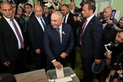 Armenia Election 2026: Pashinyan’s Party Wins as Country Balances West and Russia Pro-West Victory in Armenia’s Election Armenia’s ruling Civil Contract Party, led by Prime Minister Nikol Pashinyan, has won a key parliamentary election seen as a turning point in the country’s foreign policy direction. The party secured 49.8 percent of the vote, ahead of the Strong Armenia Alliance with 23.2 percent. The Armenia Alliance finished third with 9.9 percent. Although the result showed strong support, early projections indicated Civil Contract crossed the 50 percent mark, allowing Pashinyan to declare victory. Election Held in a Tense Political Climate The vote came after a difficult period for Armenia, following its military defeat against Azerbaijan in 2023. That loss reshaped domestic politics and intensified debate over whether Armenia should move closer to the West or maintain its long standing ties with Russia. Turnout reached 59 percent, according to the electoral commission. Nineteen political groups took part, but only a few managed to secure seats in parliament. Foreign Policy Divide Between West and Russia Pashinyan has pushed for stronger relations with Europe and Western partners. After the results, France and the European Union congratulated him and welcomed Armenia’s continued engagement with the West. Russia responded with criticism. Foreign ministry spokesperson Maria Zakharova claimed opposition parties faced heavy pressure and alleged Western interference. She also said the election reflected deep political division inside Armenian society. Opposition Parties and Political Landscape Several opposition groups with pro Russian leanings failed to challenge the ruling party effectively. The Prosperous Armenia party, led by businessman Gagik Tsarukyan, received 4 percent of the vote. Other opposition forces, including the Strong Armenia Alliance and Armenia Alliance, are linked to influential figures with close ties to Russia. Despite this, they were unable to gain significant ground against Civil Contract. Shifting Public Support for Pashinyan Public backing for Pashinyan has dropped over time, falling from about 54 percent in 2021 to nearly 30 percent in recent polls. Even so, his party maintained a leading position in this election, highlighting a fragmented opposition and a divided electorate.