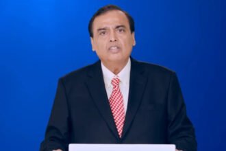 Jio Platforms Moves Toward Major IPO Mukesh Ambani’s Jio Platforms, part of Reliance Industries, has moved closer to launching a public share sale. The company board has approved a draft prospectus for an initial public offering. Ambani shared this development during Reliance’s annual shareholder meeting. Market reports suggest the IPO could raise around four billion dollars. Jio already serves more than five hundred million users, making it India’s largest telecom operator. Strong Market Attention on the Listing Investors are closely tracking the IPO because it may show how much demand exists for new listings in India’s stock market. Analysts view this move as a key test after recent market fluctuations. A strong response could support more large company listings in the future. Ambani said the listing would show that India can build large scale technology companies with global reach and value. Growth From Telecom to Technology Powerhouse Jio launched in 2016 with low cost mobile data plans. The strategy quickly disrupted India’s telecom sector and attracted millions of users in a short time. Since then, the company has expanded beyond telecom services. It now works in cloud computing, enterprise solutions, and artificial intelligence. This expansion has helped Jio move from a telecom provider to a broader digital infrastructure company. Global Partnerships and Expansion Jio and Bharti Airtel both signed agreements with SpaceX to bring Starlink internet services to India. This step signals growing interest in satellite based connectivity across the country. Earlier this month, Meta also announced plans to use capacity from a new AI focused data center being developed by Reliance in Gujarat. The facility is expected to support large scale computing demand. Impact on India’s Capital Markets The Jio IPO comes shortly after the National Stock Exchange filed documents for its own public listing. That IPO may raise more than three billion dollars if it proceeds as expected. Together, these listings could become some of the largest in India in recent years, similar to major global share offerings seen in the automotive sector. Market experts say Jio’s performance after listing will influence investor confidence in upcoming IPOs. What Investors Are Watching Jio’s listing has gained attention because of its scale, user base, and fast growth in digital services. Investors will focus on valuation, pricing, and demand during the offer period. A strong debut could increase activity in India’s IPO market. A weaker response may slow down upcoming listings.