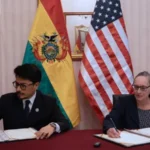 Bolivia and US sign $20 million drug trafficking cooperation deal New agreement to fight drug networks Bolivia has agreed a new security partnership with the United States worth up to $20 million. The funding will support training and equipment for Bolivian forces working against drug trafficking and organised crime. The deal marks a clear shift in relations between the two countries after nearly two decades of limited cooperation. Shift in Bolivia US relations Relations changed significantly after former President Evo Morales removed the US Drug Enforcement Administration from Bolivia 18 years ago. Bolivia is still one of the world’s main producers of coca leaves, which are used to make cocaine. Under President Rodrigo Paz, ties with Washington are now improving. Bolivia has also joined the US led “Shield of the Americas” security initiative focused on regional crime and drug networks. Training and security support The US embassy confirmed it will work closely with Bolivia to provide training, equipment, and wider support for law enforcement. The Bolivian foreign ministry said the goal is to strengthen institutions responsible for public security, investigations, and tackling organised crime. The agreement was signed in La Paz shortly after Bolivia appointed Ernesto Justiniano as defence minister, who previously served as the country’s drug czar. Regional cooperation and political support Earlier this year, President Paz attended the first Shield of the Americas summit in Florida, hosted by US President Donald Trump, along with other regional leaders. The alliance has publicly supported Paz during recent political unrest in Bolivia. In May, member countries expressed concern over protests and road blockades, saying they aimed to destabilise the elected government.