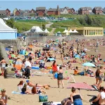 Teen suffers life changing injury after Barry Island attack A 17 year old boy from Cardiff has had his leg amputated after being stabbed during an incident at Barry Island on 25 May. Police confirmed the injury turned out to be far more serious than doctors first believed. Emergency treatment and critical condition The teenager was rushed to the University Hospital of Wales in Cardiff, where he received urgent care. Medical staff initially did not expect the injury to be life threatening or permanently disabling. His condition later worsened, leading to the decision to amputate his leg. Police investigation continues South Wales Police said the teenager remains in critical care support during recovery. Officers are reviewing hundreds of hours of CCTV footage from the area and are also working to identify and speak with witnesses who may have seen what happened. Suspect released on bail An 18 year old man from Cardiff was arrested on suspicion of causing serious harm with intent. He has been released on bail while police continue their enquiries. Family receiving support Investigating officers described the situation as deeply distressing for the victim and his family. A specially trained family liaison officer has been assigned to support them during this difficult time.