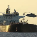 A Russian shadow fleet tanker captain has been charged in the UK for breaching sanctions after a Royal Marines interception in the English Channel linked to Russian oil shipments.