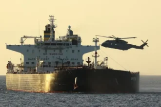 A Russian shadow fleet tanker captain has been charged in the UK for breaching sanctions after a Royal Marines interception in the English Channel linked to Russian oil shipments.