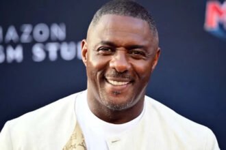 Idris Elba on James Bond Casting and “Woke” Debate: Full Summary Idris Elba speaks on James Bond role and global audience reaction British actor Sir Idris Elba has shared his thoughts on the ongoing debate around the future of James Bond. He said the character should stay true to its original identity and warned against changing it in ways that could divide audiences. Elba also addressed long running speculation linking him to the role of 007, saying he has never been officially in the running, even though he feels flattered by the attention. He explained that James Bond has a specific legacy and tone, and that this should not be altered too much. According to him, the franchise is built on escapism, and changing its core identity to match modern debates could take away from what makes it popular worldwide. Elba comments on diversity and audience expectations Elba pointed out that global audiences react differently to casting choices. He suggested that some viewers may not accept a Black actor in the role of James Bond, especially in certain regions. While expressing this view, he emphasized that Bond is a fictional character and should remain consistent with how it was originally created. He also said that trying to adjust the character to fit every cultural expectation could weaken the story. Instead, he believes the focus should remain on maintaining the traditional style of the franchise. “Man at Arms” role and casting humor Elba is currently appearing in a new project where he plays Man at Arms from Masters of the Universe. He joked about the contrast between his real appearance and the animated character, noting that the role shows how flexible casting can be in fantasy worlds. He highlighted that fictional characters can be reimagined more freely than grounded roles like James Bond. James Bond franchise continues search for new actor The search for the next James Bond is officially underway after years of speculation following Daniel Craig’s departure in No Time To Die. Production insiders confirm that casting auditions are ongoing, although details remain private. The next Bond film will be directed by Denis Villeneuve and written by Steven Knight. Industry reports suggest casting director Nina Gold is leading the selection process. Several well known actors are rumored to be in consideration, including Callum Turner, Henry Cavill, and Aaron Taylor Johnson.