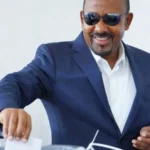 Ethiopia Election Results: Abiy Ahmed Secures Landslide Victory Amid Rising Security Concerns Election outcome and political dominance Ethiopian Prime Minister Abiy Ahmed’s Prosperity Party has secured a sweeping victory in the general election, winning 438 of the 501 contested seats. This result ensures another term for Abiy and confirms his strong control over parliament. The government is expected to continue under his leadership when he is sworn in for a new term in October. Supporters of Abiy say the outcome reflects stability and progress. They point to economic reforms and development efforts as signs of positive change in the country. Low participation and disputed legitimacy The election took place in a tense environment. Several opposition groups did not take part, and many questioned the fairness of the process. Security problems also disrupted voting in parts of the country. On election day, 143 polling stations did not open in the two most populated regions due to clashes involving armed groups. This raised further doubts about how inclusive the vote could be. Armed conflict and regional instability Security remains one of Ethiopia’s biggest challenges. Armed groups such as the Fano militia in Amhara and the Oromo Liberation Army in Oromia rejected the election results. Both groups are pushing for greater autonomy and continue to clash with government forces. In Tigray, the situation is still fragile after a two year civil war that ended in 2022. The region, which includes around six million people, was fully excluded from the election. This exclusion increased fears that tensions could escalate again. Tensions with Eritrea and regional risks Relations between Ethiopia and Eritrea have also worsened. During the Tigray conflict, the two countries were aligned against Tigrayan forces. Since then, relations have broken down sharply. Ethiopia has repeatedly raised the issue of access to a Red Sea port, which it lost after Eritrea became independent in 1993. Eritrea, in turn, accuses Ethiopia of expansionist ambitions. Analysts warn that shifting alliances between Eritrea, Tigrayan leaders, and Ethiopian authorities could increase the risk of renewed regional conflict. Wider regional instability Ethiopia is also facing external pressure linked to the ongoing war in Sudan. Reports have suggested possible Ethiopian support for one of Sudan’s armed factions, although the government denies this. The situation adds another layer of uncertainty in an already volatile region.