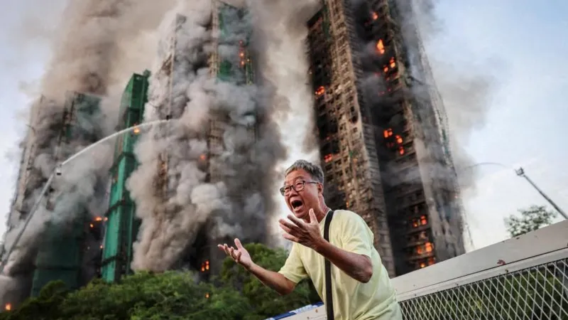# Hong Kong Files First Criminal Charges in Deadly Wang Fuk Court Fire Case ## Major Legal Action After Deadly Housing Complex Fire Hong Kong authorities have filed the first criminal charges related to the devastating fire at Wang Fuk Court, a tragedy that claimed 168 lives and left thousands without homes. The incident, which occurred in November last year, became the city's deadliest fire disaster in more than seven decades. Prosecutors charged two companies and seven individuals with a total of 25 offences. The allegations include manslaughter, fraud, corruption, money laundering, tax evasion, and attempting to obstruct justice. ## Companies and Executives Face Manslaughter Charges Authorities charged engineering consultancy firm Will Power Architects and construction contractor Prestige Construction and Engineering with manslaughter. Several senior figures also face criminal charges. These include Prestige director Ho Kin-yip, Will Power director Wong Hap-yin, and registered inspector Ng Yeuk. Officials denied bail to all three men during a court hearing on Wednesday. Investigators believe serious safety failures contributed directly to the scale of the disaster. ## Investigation Reveals Critical Safety Failures An independent inquiry found multiple breaches of fire safety regulations throughout the housing complex. According to investigators, workers had disabled fire alarm systems in seven of the eight residential blocks during renovation work. The inquiry also found that contractors had covered windows with highly flammable foam boards. These materials likely accelerated the spread of the fire. Legal representatives leading the inquiry stated that nearly every major fire protection system failed when residents needed them most. Investigators also examined reports that workers frequently discarded lit cigarette butts around the construction site. ## Corruption and Fraud Allegations Expand the Case The case extends beyond fire safety concerns. Hong Kong's anti corruption agency filed additional charges against seven people, including Wong's wife and a close associate. Authorities allege that suspects manipulated the renovation tender process and falsified project supervision records. Investigators also accuse several individuals of laundering money connected to the project. Officials further claim that some suspects attempted to mislead investigators by hiding large amounts of cash and encouraging witnesses to provide false statements. ## More Arrests and Ongoing Investigations Police have arrested 35 people in connection with suspected manslaughter and fraud offences. Separately, anti corruption investigators detained 23 individuals, including contractors, consultants, and members of the building's owners' corporation. Authorities have not confirmed how many of those individuals remain under investigation or have since been released. The court has postponed the case until 2 September to allow investigators additional time to gather evidence and prepare further proceedings. ## Public Response and Media Scrutiny The disaster sparked widespread public concern across Hong Kong. Following the fire, authorities in both Hong Kong and Beijing urged media organizations and commentators to avoid spreading misinformation about the government's response. Days after the tragedy, national security police arrested local columnist Wong Kwok-ngon. Authorities accused him of publishing content intended to create hostility toward the government over its handling of the disaster. As investigations continue, the Wang Fuk Court fire remains one of the most significant public safety cases in Hong Kong's recent history.