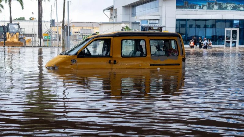 Accra Floods Kill 13 as Heavy Rain Triggers Widespread Damage Across Ghana's Capital Heavy rainfall caused deadly flooding across Accra, the capital of Ghana, leaving at least 13 people dead and forcing emergency teams to rescue hundreds of residents. Authorities have warned that another storm is approaching, increasing the risk of more flooding in the coming hours. Torrential Rain Leaves Parts of Accra Underwater A powerful overnight downpour flooded streets, homes, and businesses across several neighborhoods in Accra. Water quickly covered low lying areas, trapping residents inside their homes and leaving many vehicles stranded. Emergency workers responded throughout the city as floodwaters spread rapidly. Videos shared online showed submerged houses, damaged buildings, and roads that had become impossible to use. Officials said the number of deaths could rise as rescue teams continue searching the affected communities. Rescue Teams Save Hundreds of Residents Emergency services launched large scale rescue operations soon after the flooding began. Firefighters, police officers, military personnel, and disaster response teams worked together to reach stranded families. According to the Ghana National Fire Service, rescue crews have already helped more than 470 people reach safety. Teams remain on alert because some residents are still trapped in flooded neighborhoods. The Interior Ministry said security personnel will continue monitoring affected areas to protect both lives and property during the emergency. Government Urges Residents to Stay Safe Government officials asked residents to stay indoors if they are already in a safe place. People living in flood affected homes have been advised to move to higher ground immediately. Authorities also warned everyone to avoid walking or driving through flooded roads because strong currents can quickly become dangerous. Residents needing emergency assistance have been instructed to contact emergency services without delay. Heavy Rainfall Raises Climate Concerns President John Mahama said preliminary weather data showed that approximately 140 millimeters of rain fell over Accra during the storm. He noted that the city's highest single day rainfall last year measured only about 56 millimeters. The unusually heavy rainfall has raised fresh concerns about the growing impact of climate change on extreme weather events in the region. More Rain Expected Across Southern Ghana The Ghana Meteorological Agency has warned that another storm system moving from the east could bring additional rainfall across southern Ghana, including Accra. Weather officials advised residents to avoid sheltering beneath trees, stay away from damaged electrical wires, and never attempt to cross floodwaters on foot or by vehicle. Emergency authorities remain on high alert as they continue rescue operations and prepare for the possibility of further flooding. Accra Faces Growing Flood Risks Accra is one of Africa's fastest growing cities and is home to more than four million people. Rapid urban growth, combined with intense seasonal rainfall, has increased the city's vulnerability to flooding in recent years. As recovery efforts continue, officials are urging residents to follow safety instructions and remain prepared until weather conditions improve.