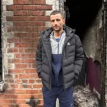 Home Lost in Belfast Fire as Resident Says He Will “Never Get Over” Watching It Burn Residents flee after overnight violence in east Belfast Families in Belfast were forced to leave their homes during a night of unrest that followed a knife attack on Monday. Several houses across the city were damaged after fires broke out during the disorder. Among those affected was a family with a two month old baby, who had to escape as the situation escalated. East Belfast home destroyed in blaze A man from Lendrick Street in east Belfast said he lost the house he had lived in for 13 years after it was set on fire during the chaos. He said the fire began after a nearby car, linked to foreign nationals, was ignited. The flames then spread quickly, leaving little time for firefighters to save the property. By the time emergency crews arrived, the house was already fully burning and could not be saved. “I’ll never get over it,” says homeowner Speaking outside the remains of his home, the man said the experience left him devastated. He described the moment he watched the house burn as something he would carry with him for life. He said the property held many personal and sentimental items that cannot be replaced. Although he expressed anger about the wider violence, he questioned what the destruction had achieved and said it only harmed the local community further. Community impact and ongoing concern The unrest has left several families displaced and facing major losses. While no one from the affected household was injured, the emotional and financial damage is severe. The resident said he was relieved his children were not inside the house at the time of the fire.
