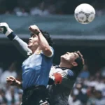 I Didn’t Plan to Be at Argentina vs England 1986 World Cup A Last Minute Ticket Changed Everything I never expected to be at a World Cup match. I was 17 and had never even attended a football game before. Football was not part of my life. That changed in a single morning when the phone rang. A friend of my father could not use two tickets. My mother and I were invited to take them. It felt unreal. We decided quickly. We went to Mexico City without overthinking it. Family Concerns After a Tense History My father felt unsure about sending us. The memory of the Falklands War was still fresh, and he worried about tension between Argentine and English supporters. Still, my mother did not want to miss the chance. She saw it as a once in a lifetime experience. She believed we should go. Journey to Azteca Stadium The drive through Mexico City felt alive. Cars carried flags. People shouted chants from windows. The city felt like it belonged to the World Cup. Even though Mexico was already out of the tournament, fans still celebrated as if they were part of everything. I joined in without thinking too much. I shouted along with the crowds. It felt more like a festival than a football match. My First Impression of Football Culture Football itself was not my focus. I treated the day like a celebration. I dressed up carefully, more like going to a party than a stadium. My mother noticed but did not stop me. I expected excitement, but not what I saw next. Inside Azteca Stadium The Azteca was overwhelming. It was huge, loud, and full of color. Fans from many countries filled the stands. People sang, laughed, and celebrated together. The energy was constant. The stadium felt like the center of the world. At that moment, I cared less about the game and more about the experience of being there.