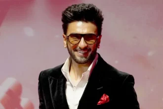 Indian Film Workers Union Withdraws Boycott Against Ranveer Singh Over Don 3 Exit Background of the Dispute A major film workers body in India has pulled back its call to stop members from working with Ranveer Singh after controversy surrounding his reported exit from the film Don 3. The Federation of Western India Cine Employees raised concerns last month after producers said Singh left the project only weeks before an overseas shoot was set to begin. The decision led to tension across the industry, as the film had already entered an advanced stage of preparation. Why the Boycott Was Announced Producers of Don 3 claimed that Singh’s sudden departure caused major disruption and financial strain. Reports suggest around 450 million rupees were spent on early production work before filming was paused. After these complaints, the film workers union asked its members not to collaborate with Singh until he clarified his position. Legal Pressure and Industry Response The situation escalated when Singh reportedly sent a legal notice to the union. The union later confirmed it would respond through its legal team. Shortly after, senior figures in the industry stepped in. Federation president BN Tiwari publicly supported Singh and said the wider film community stood with him. Industry adviser Ashoke Pandit also encouraged dialogue and suggested a direct meeting to resolve the issue. Don Franchise Legacy The Don series remains one of Bollywood’s most iconic action franchises. It began with superstar Amitabh Bachchan in 1978 and was later rebooted by Shah Rukh Khan under the direction of Farhan Akhtar. The upcoming installment starring Singh was expected to continue this legacy. Current Position of the Union The Federation of Western India Cine Employees later withdrew its informal boycott call. Officials said they do not have the authority to ban any artist and expressed hope for a positive resolution. The union also noted that several industry groups requested the withdrawal of the directive. Singh’s Response and Career Context Singh has not spoken publicly about the matter. His team previously said he respects the Don franchise and the wider film industry and chose to remain silent during the dispute. He remains one of India’s leading stars, with major films including Padmaavat and Gully Boy, along with recent commercial successes. Rare Industry Action Such public boycott calls against major film stars are uncommon. The union has previously issued similar directives in other politically sensitive situations involving cross border collaborations and casting disputes.