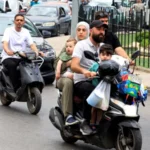 # Israel Orders Strikes on Beirut Suburbs as Hezbollah Conflict Intensifies ## Thousands Flee Beirut's Southern Suburbs Israel has announced new military strikes on the southern suburbs of Beirut after accusing Hezbollah of carrying out repeated rocket and drone attacks. The latest escalation has increased fears of a wider regional conflict despite ongoing efforts to maintain a ceasefire. Israeli Prime Minister Benjamin Netanyahu and Defence Minister Israel Katz said they had ordered attacks on what they described as Hezbollah targets in the Dahieh district, a known Hezbollah stronghold in southern Beirut. Following the announcement, thousands of residents rushed to leave the area. Roads quickly became congested as families packed their vehicles with essential belongings and searched for safer locations. ## Israel Links Beirut Strikes to Hezbollah Attacks Israeli officials stated that Hezbollah had repeatedly violated the ceasefire agreement announced in April. According to Israel, the strikes are a response to attacks targeting Israeli civilians and communities in northern Israel. Defence Minister Katz warned that calm would not return to Beirut unless attacks against northern Israel stopped. Shortly afterward, the Israeli military issued evacuation warnings to residents in parts of Dahieh. The warning triggered a mass movement of civilians. Families carrying suitcases, blankets, and personal belongings left their homes as concerns over further airstrikes grew. ## Civilians Face Growing Uncertainty Many residents expressed support for Hezbollah while also prioritizing the safety of their families. Parents, children, and elderly relatives traveled together through heavy traffic as they sought shelter away from potential conflict zones. Although Israeli forces have carried out strikes in Beirut since the April ceasefire, the frequency of attacks has significantly decreased compared to earlier stages of the conflict. However, the latest developments have raised concerns that tensions could rise again. ## Diplomatic Efforts Continue Lebanese officials said they are relying on diplomatic channels, particularly US mediation efforts, to prevent further escalation and reduce civilian casualties. US Secretary of State Marco Rubio recently presented a proposal aimed at gradually reducing tensions between the parties. Regional leaders continue discussions in hopes of preventing a broader conflict. Iran, a longtime supporter of Hezbollah, has also stressed that any future agreement should include stability in Lebanon. Iranian officials argue that peace efforts should apply across all fronts in the region. ## Violence Continues in Southern Lebanon While attention remains focused on Beirut, fighting has continued in southern Lebanon. Local media reported that Israeli airstrikes killed several people in villages and towns across the region. At the same time, the Israeli military confirmed the death of one soldier during operations in southern Lebanon. Reports suggest a drone attack may have been responsible. ## Rising Casualties Highlight Human Cost The conflict has caused significant losses on both sides. Lebanese health authorities report that more than 3,400 people have died since the war began. The figures include both civilians and fighters. Israel has reported the deaths of 24 soldiers and four civilians during the conflict. As military operations continue and diplomatic efforts struggle to gain momentum, many residents across Lebanon and Israel remain uncertain about what comes next.