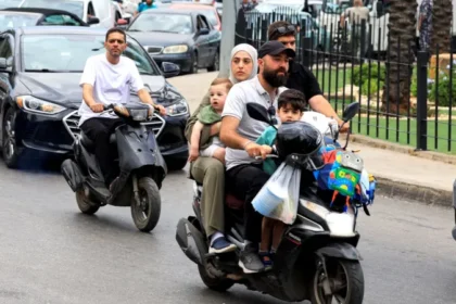 # Israel Orders Strikes on Beirut Suburbs as Hezbollah Conflict Intensifies ## Thousands Flee Beirut's Southern Suburbs Israel has announced new military strikes on the southern suburbs of Beirut after accusing Hezbollah of carrying out repeated rocket and drone attacks. The latest escalation has increased fears of a wider regional conflict despite ongoing efforts to maintain a ceasefire. Israeli Prime Minister Benjamin Netanyahu and Defence Minister Israel Katz said they had ordered attacks on what they described as Hezbollah targets in the Dahieh district, a known Hezbollah stronghold in southern Beirut. Following the announcement, thousands of residents rushed to leave the area. Roads quickly became congested as families packed their vehicles with essential belongings and searched for safer locations. ## Israel Links Beirut Strikes to Hezbollah Attacks Israeli officials stated that Hezbollah had repeatedly violated the ceasefire agreement announced in April. According to Israel, the strikes are a response to attacks targeting Israeli civilians and communities in northern Israel. Defence Minister Katz warned that calm would not return to Beirut unless attacks against northern Israel stopped. Shortly afterward, the Israeli military issued evacuation warnings to residents in parts of Dahieh. The warning triggered a mass movement of civilians. Families carrying suitcases, blankets, and personal belongings left their homes as concerns over further airstrikes grew. ## Civilians Face Growing Uncertainty Many residents expressed support for Hezbollah while also prioritizing the safety of their families. Parents, children, and elderly relatives traveled together through heavy traffic as they sought shelter away from potential conflict zones. Although Israeli forces have carried out strikes in Beirut since the April ceasefire, the frequency of attacks has significantly decreased compared to earlier stages of the conflict. However, the latest developments have raised concerns that tensions could rise again. ## Diplomatic Efforts Continue Lebanese officials said they are relying on diplomatic channels, particularly US mediation efforts, to prevent further escalation and reduce civilian casualties. US Secretary of State Marco Rubio recently presented a proposal aimed at gradually reducing tensions between the parties. Regional leaders continue discussions in hopes of preventing a broader conflict. Iran, a longtime supporter of Hezbollah, has also stressed that any future agreement should include stability in Lebanon. Iranian officials argue that peace efforts should apply across all fronts in the region. ## Violence Continues in Southern Lebanon While attention remains focused on Beirut, fighting has continued in southern Lebanon. Local media reported that Israeli airstrikes killed several people in villages and towns across the region. At the same time, the Israeli military confirmed the death of one soldier during operations in southern Lebanon. Reports suggest a drone attack may have been responsible. ## Rising Casualties Highlight Human Cost The conflict has caused significant losses on both sides. Lebanese health authorities report that more than 3,400 people have died since the war began. The figures include both civilians and fighters. Israel has reported the deaths of 24 soldiers and four civilians during the conflict. As military operations continue and diplomatic efforts struggle to gain momentum, many residents across Lebanon and Israel remain uncertain about what comes next.