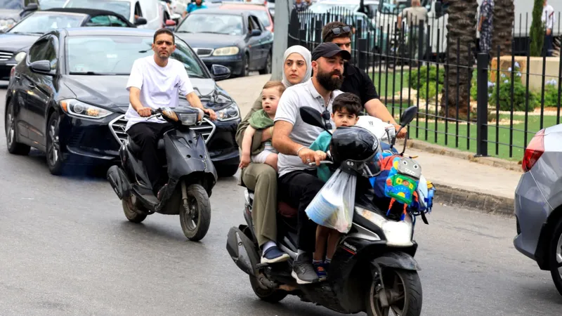 # Israel Orders Strikes on Beirut Suburbs as Hezbollah Conflict Intensifies ## Thousands Flee Beirut's Southern Suburbs Israel has announced new military strikes on the southern suburbs of Beirut after accusing Hezbollah of carrying out repeated rocket and drone attacks. The latest escalation has increased fears of a wider regional conflict despite ongoing efforts to maintain a ceasefire. Israeli Prime Minister Benjamin Netanyahu and Defence Minister Israel Katz said they had ordered attacks on what they described as Hezbollah targets in the Dahieh district, a known Hezbollah stronghold in southern Beirut. Following the announcement, thousands of residents rushed to leave the area. Roads quickly became congested as families packed their vehicles with essential belongings and searched for safer locations. ## Israel Links Beirut Strikes to Hezbollah Attacks Israeli officials stated that Hezbollah had repeatedly violated the ceasefire agreement announced in April. According to Israel, the strikes are a response to attacks targeting Israeli civilians and communities in northern Israel. Defence Minister Katz warned that calm would not return to Beirut unless attacks against northern Israel stopped. Shortly afterward, the Israeli military issued evacuation warnings to residents in parts of Dahieh. The warning triggered a mass movement of civilians. Families carrying suitcases, blankets, and personal belongings left their homes as concerns over further airstrikes grew. ## Civilians Face Growing Uncertainty Many residents expressed support for Hezbollah while also prioritizing the safety of their families. Parents, children, and elderly relatives traveled together through heavy traffic as they sought shelter away from potential conflict zones. Although Israeli forces have carried out strikes in Beirut since the April ceasefire, the frequency of attacks has significantly decreased compared to earlier stages of the conflict. However, the latest developments have raised concerns that tensions could rise again. ## Diplomatic Efforts Continue Lebanese officials said they are relying on diplomatic channels, particularly US mediation efforts, to prevent further escalation and reduce civilian casualties. US Secretary of State Marco Rubio recently presented a proposal aimed at gradually reducing tensions between the parties. Regional leaders continue discussions in hopes of preventing a broader conflict. Iran, a longtime supporter of Hezbollah, has also stressed that any future agreement should include stability in Lebanon. Iranian officials argue that peace efforts should apply across all fronts in the region. ## Violence Continues in Southern Lebanon While attention remains focused on Beirut, fighting has continued in southern Lebanon. Local media reported that Israeli airstrikes killed several people in villages and towns across the region. At the same time, the Israeli military confirmed the death of one soldier during operations in southern Lebanon. Reports suggest a drone attack may have been responsible. ## Rising Casualties Highlight Human Cost The conflict has caused significant losses on both sides. Lebanese health authorities report that more than 3,400 people have died since the war began. The figures include both civilians and fighters. Israel has reported the deaths of 24 soldiers and four civilians during the conflict. As military operations continue and diplomatic efforts struggle to gain momentum, many residents across Lebanon and Israel remain uncertain about what comes next.