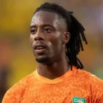 Visa cleared for Ivory Coast forward Elye Wahi Ivory Coast striker Elye Wahi has been cleared to enter Canada after initial visa delays raised concerns over his participation in the World Cup. He is now set to join the national squad for their group match against Germany. Ivory Coast national football team confirmed that all required travel permissions were secured after Canadian authorities requested further review of his legal situation. Investigation in France linked to spot fixing allegations Wahi has been linked to an ongoing investigation in France involving allegations of spot fixing and financial wrongdoing in football. Authorities in Marseille previously questioned a professional player from Ligue 1 as part of a wider probe. French football officials said they had been alerted to unusual betting activity related to a yellow card received by Wahi during a match against Metz in May. He has not been charged and was released after questioning. The investigation is still ongoing. Canada delays entry, then approves visa Canadian immigration officials initially delayed Wahi’s entry while reviewing available information. The decision was later reversed after additional checks were completed. Officials stated that each application is assessed individually under Canadian immigration law. They also confirmed that temporary permits can be granted in special cases when required conditions are met. The football federation later confirmed that Wahi had received approval and would travel with the squad. Match schedule remains unchanged Wahi is expected to be available for Ivory Coast’s upcoming World Cup fixtures. The team will face Germany in Toronto, followed by their next group match in Philadelphia. Previous legal developments in France Reports from Marseille prosecutors indicate that the investigation includes allegations of organized fraud, sports corruption, handling criminal proceeds, and money laundering. Wahi was questioned but later released. Football authorities in France have not opened disciplinary action yet but may do so depending on the outcome of the investigation. Similar visa issue involving another player Another World Cup player also faced entry issues when Ghana midfielder Thomas Partey was denied a visa to Canada due to ongoing legal proceedings in the United Kingdom. His case remains separate and unrelated to Wahi.