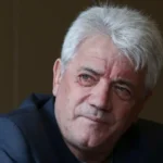 Kevin Keegan shares stage four cancer diagnosis Overview of the diagnosis Former England captain and manager Kevin Keegan has revealed that he is living with stage four cancer. Stage four means the illness has spread beyond its original site to other parts of the body. His family first shared news of his condition in January after doctors carried out further tests linked to ongoing abdominal symptoms. Those checks followed a hospital visit. How the diagnosis was found Keegan explained that the condition was discovered during medical scans linked to an operation after a car accident. During those scans, doctors identified cancer and referred him to specialist care. He said he was offered a newer treatment plan with a specialist doctor. The treatment has shown mixed success rates, but Keegan confirmed he continues to receive care and remains in treatment. Public appearance and emotional reception Keegan recently made one of his first public appearances since the diagnosis at the Tyne Theatre and Opera House in Newcastle upon Tyne. He received a standing ovation from fans in a deeply emotional return to the city closely linked with his football legacy and his time at Newcastle United. Football career and legacy As a player, Keegan represented clubs including Scunthorpe United, Liverpool, Hamburger SV, Southampton, and Newcastle United. He later became a manager for Newcastle United, Fulham, the England national team, and Manchester City. He remains one of the most influential figures in Newcastle United history, especially for leading the team during the attacking era often remembered by fans. Connection with Newcastle United today Current Newcastle manager Eddie Howe previously reached out to Keegan after taking charge in 2021 to understand the club culture and expectations. Keegan has expressed a wish to return to St James Park to say a proper goodbye, although he has not attended a match there since 2008. The club continues to support him and has sent public messages of care and encouragement, saying he will always be welcome at the stadium. Personal reflections Keegan has said he does not feel the need for a statue outside the stadium. He stated that how fans treat him matters more than any physical tribute. He remains positive about his situation and continues to focus on treatment and time with his family.