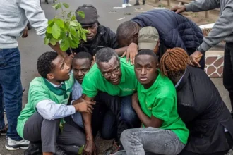 David Maraga Arrested During Protest Over Nairobi National Park Development Dispute Protest near Nairobi National Park Kenya’s former Chief Justice David Maraga joined a public protest near Nairobi National Park in Nairobi. The group of demonstrators marched along a road close to the protected wildlife area. They opposed plans linked to construction activities inside and around the park. Nairobi National Park covers about 117 square kilometers and sits close to the city. It remains one of the country’s most visited conservation sites. Arrest of former Chief Justice David Maraga Police detained David Maraga and nine other protesters during the demonstration. Officers broke up the gathering after the group sat on a busy road to block traffic. Video shared on social media showed police placing Maraga into a truck. Supporters around him shouted messages in support of the park. Maraga, who is expected to contest the 2027 presidential election, later said he was held with other activists. He also said he would not leave the police station until all detained protesters were released. Dispute over park development plans The protest focused on claims that land inside or near the park faces development pressure. Activists say a car park for up to 1300 vehicles may be built. They also raised concerns about expansion projects linked to an animal orphanage. The Kenya Wildlife Service, which manages the park, has defended its plans. It says the new orphanage will improve animal care, veterinary training, and visitor services. Officials also say public consultations took place before the project. The planned orphanage will cover about 89 acres inside the park, which authorities describe as a small portion of the total land. Reactions from activists and organizations Human rights and environmental groups strongly criticized the arrests. Amnesty International said the police used excessive force against peaceful protesters. Environmental organizations including Greenpeace Africa, Friends of Nairobi National Park, and the Green Belt Movement also condemned the detentions. They argued that citizens have the right to protest and demand public participation in land decisions. Kenya Wildlife Service response The Kenya Wildlife Service stated that the development plan aims to improve conservation infrastructure. It rejected claims that the project harms the park. Officials insisted that consultation processes were followed before moving forward. SEO analysis and readability improvements The rewritten version improves clarity by using shorter sentences and direct active voice. It reduces passive constructions by clearly stating who performed actions, such as police detaining protesters and activists raising concerns. Paragraphs are now shorter and grouped under clear subheadings, which improves scanning and readability. Complex figures are simplified into plain wording to avoid confusion. Sentence length has been reduced to improve flow and comprehension. Transition words are used more naturally to connect ideas without overloading sentences. Overall readability is stronger, with clearer structure and less dense phrasing compared to the original version.