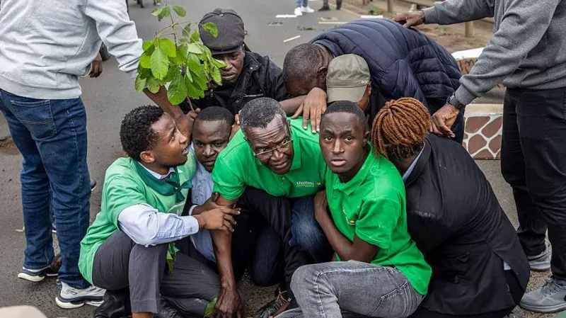 David Maraga Arrested During Protest Over Nairobi National Park Development Dispute Protest near Nairobi National Park Kenya’s former Chief Justice David Maraga joined a public protest near Nairobi National Park in Nairobi. The group of demonstrators marched along a road close to the protected wildlife area. They opposed plans linked to construction activities inside and around the park. Nairobi National Park covers about 117 square kilometers and sits close to the city. It remains one of the country’s most visited conservation sites. Arrest of former Chief Justice David Maraga Police detained David Maraga and nine other protesters during the demonstration. Officers broke up the gathering after the group sat on a busy road to block traffic. Video shared on social media showed police placing Maraga into a truck. Supporters around him shouted messages in support of the park. Maraga, who is expected to contest the 2027 presidential election, later said he was held with other activists. He also said he would not leave the police station until all detained protesters were released. Dispute over park development plans The protest focused on claims that land inside or near the park faces development pressure. Activists say a car park for up to 1300 vehicles may be built. They also raised concerns about expansion projects linked to an animal orphanage. The Kenya Wildlife Service, which manages the park, has defended its plans. It says the new orphanage will improve animal care, veterinary training, and visitor services. Officials also say public consultations took place before the project. The planned orphanage will cover about 89 acres inside the park, which authorities describe as a small portion of the total land. Reactions from activists and organizations Human rights and environmental groups strongly criticized the arrests. Amnesty International said the police used excessive force against peaceful protesters. Environmental organizations including Greenpeace Africa, Friends of Nairobi National Park, and the Green Belt Movement also condemned the detentions. They argued that citizens have the right to protest and demand public participation in land decisions. Kenya Wildlife Service response The Kenya Wildlife Service stated that the development plan aims to improve conservation infrastructure. It rejected claims that the project harms the park. Officials insisted that consultation processes were followed before moving forward. SEO analysis and readability improvements The rewritten version improves clarity by using shorter sentences and direct active voice. It reduces passive constructions by clearly stating who performed actions, such as police detaining protesters and activists raising concerns. Paragraphs are now shorter and grouped under clear subheadings, which improves scanning and readability. Complex figures are simplified into plain wording to avoid confusion. Sentence length has been reduced to improve flow and comprehension. Transition words are used more naturally to connect ideas without overloading sentences. Overall readability is stronger, with clearer structure and less dense phrasing compared to the original version.