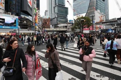 Shibuya Introduces Instant Fines for Littering in Busy Tourist Areas New Fine System Starts in Shibuya Shibuya Ward in Tokyo has started issuing instant fines for littering in busy public areas. The penalty is 2,000 yen, which is about 13 dollars or 9 pounds. The rule began this week and targets both residents and tourists. Officials say the measure is designed to keep one of Japan’s busiest entertainment districts clean. Shibuya Crossing, one of the most visited landmarks in Japan, sits at the centre of this campaign. Growing Tourism Pressure in Japan Japan has seen a sharp rise in international visitors. The country welcomed a record 42.7 million tourists in 2025. This surge has created new pressure on public spaces, especially in major cities like Tokyo. Local authorities report more cases of public drinking and littering in crowded tourist zones. Officials say this behaviour has increased concerns among residents and businesses. How the Fine System Works The new system allows enforcement officers to issue fines immediately. People can pay using cash, bank cards, or QR code payments. Around 50 officers will patrol key areas to enforce the rules. Authorities have also asked food and drink businesses to install waste bins where possible. The goal is to reduce litter before it appears on the streets. Officials in Shibuya stated that littering will not be accepted simply because bins are limited. They said the aim is to create a cleaner and more comfortable city for everyone. Why Japan Has Few Public Bins Public rubbish bins are not common in many parts of Japan. One reason is safety concerns linked to past security incidents. As a result, visitors often struggle to find places to dispose of waste. A recent survey showed that the lack of bins is one of the biggest complaints among tourists. More than 20 percent of respondents mentioned it as a major inconvenience. Tourism Strain Beyond Tokyo Other parts of Japan are also feeling the effects of rising tourism. Near Mount Fuji, the town of Fujiyoshida has experienced traffic congestion and litter problems. Local authorities even cancelled a popular cherry blossom festival due to overcrowding. National Efforts to Manage Overtourism Japan is introducing several measures to manage visitor numbers. These include higher tourist taxes and digital tools that show real time crowd levels in popular destinations. The aim is to balance tourism growth with local quality of life.