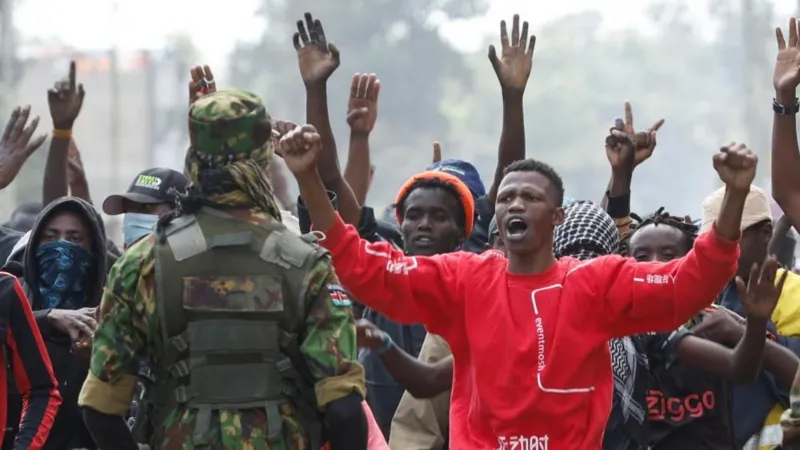 Protest Turns Violent in Nanyuki A protest in Nanyuki, a town in Kenya, turned deadly when clashes broke out between demonstrators and police over a planned Ebola isolation facility for US citizens. Witnesses reported that a man was shot during the unrest and later died. Authorities have not released an official statement on the incident. Earlier in the day, protesters gathered with Kenyan flags, placards, and even a symbolic coffin labeled Ebola. They demanded that the project be cancelled immediately. Subheading 2: Rising Tensions and Police Response Police used tear gas to disperse crowds as the demonstration escalated. Witnesses described chaos in the streets, with gunfire reported during the confrontation. According to journalists at the scene, one man was seen lying motionless after being shot. Local reports also say that similar protests in recent weeks ended in fatalities, increasing public anger and mistrust. Subheading 3: Concerns Over US Health Facility Plan The planned facility is expected to be a fifty bed isolation centre at a military base. It is designed to treat US citizens affected by an Ebola outbreak in Central Africa. Residents and protest leaders argue that the project lacks transparency and could put local communities at risk. Many fear possible disease exposure and say they were not properly consulted. Subheading 4: Legal Challenge and Public Reaction A court had already ordered a temporary halt to the project after a rights group raised concerns about public health risks. The case continues to fuel debate in the region. One protester said the project has created fear in the area and reduced visits to the county. Community members insist that their concerns must be addressed before any construction continues. Subheading 5: Background of the Ebola Situation The Ebola outbreak in parts of Central Africa has already led to hundreds of confirmed cases and over a hundred deaths. The proposed facility in Kenya is meant to support faster medical response for infected US nationals. A US official stated that Kenya was selected due to regional travel access and limited medical capacity in nearby airports.