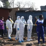 Police Launch Manhunt After Deadly Johannesburg Shooting Police in South Africa are searching for suspects after a violent attack in Johannesburg left 12 people dead and nine others injured. The incident took place in an informal settlement in the Cleveland area late Tuesday night. Authorities say a group of armed men arrived in the area and opened fire on residents before escaping in a vehicle. How the Attack Happened Police report that more than 10 armed suspects entered the Jumpers Informal Settlement. They moved through different parts of the community and fired on people at several locations. Officials say the attackers fled the scene in a white Toyota Quantum after carrying out the assault. Emergency services arrived after receiving reports of ongoing gunfire at around 23:10 local time. Police and medical teams found multiple victims at the scene. Casualties and Injuries Eight men and three women died at the location. One more victim died later in hospital due to severe injuries. Nine additional people were taken to nearby hospitals for treatment. Their condition has not been fully updated by authorities. Possible Motive Under Investigation Investigators have not confirmed a clear motive yet. However, police and local residents suspect the attack may be linked to disputes involving illegal mining groups operating in the area. Illegal mining has grown in parts of South Africa and is often connected to criminal networks and territorial conflicts. Police have described the attack as violent and deeply disturbing while continuing efforts to identify those responsible. Community and Police Response Residents of the informal settlement believe the violence may be connected to ongoing turf tensions. Police have not ruled out organized criminal activity. Law enforcement teams are reviewing evidence and following multiple leads to track down the suspects. A senior police official said the area remains under close investigation due to its proximity to illegal mining zones. Illegal Mining and Rising Violence Illegal mining continues to be a major concern in South Africa. It often takes place in abandoned mine areas where groups compete for control of resources. Authorities say such conflicts can escalate into violent confrontations that put local communities at risk.
