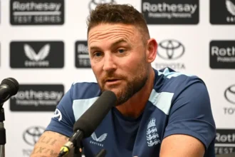 McCullum Clears the Air on Stokes Relationship England head coach Brendon McCullum has rejected talk of tension with captain Ben Stokes. He said they remain close friends and do not understand where the rumours started. McCullum explained that he spoke directly with Stokes before the third Test against New Zealand. He told him that their relationship has not changed and asked where the speculation came from. Stokes said he had no idea. Return After Disciplinary Absence Stokes missed the second Test during an internal investigation linked to a late night curfew breach after England’s win at Lord’s. Fast bowler Gus Atkinson also missed that match. Both players were present when a member of team security was struck during an incident involving a rugby player at a London nightclub. The England management cleared both players to return for the deciding match, with Stokes resuming captaincy duties. Squad Changes for the Decider England have reshaped the team again for the third Test against New Zealand. Stokes returns to lead the side. Shoaib Bashir and wicketkeeper Jamie Smith are also back in the lineup. Young batter Emilio Gay joins the XI, while experienced names such as Joe Root and Harry Brook remain central to the batting order. The pace attack includes Jofra Archer and Josh Tongue, with Gus Atkinson also returning. Players Left Out Several players miss out on selection this time. James Rew, Jordan Cox, Matthew Fisher, and Sonny Baker have been dropped from the squad. Ollie Robinson impressed earlier in the series but is not selected despite being fit. England XI for the Third Test Ben Duckett, Emilio Gay, Jacob Bethell, Joe Root, Harry Brook, Jamie Smith, Ben Stokes captain, Gus Atkinson, Jofra Archer, Josh Tongue, Shoaib Bashir