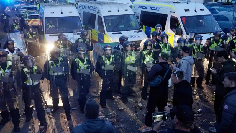 Two men jailed after violent disorder at Southampton protest over Henry Nowak murder Court sentences handed down after police injured in unrest Two men have been jailed after violent disorder broke out during a protest in Southampton linked to the murder of 18 year old Henry Nowak. Connor Bishop, 24, received a sentence of two years and eight months. Leon O’Leary, 41, was jailed for three years and one month. Both men admitted violent disorder in earlier court proceedings. The unrest took place on 2 June in the Portswood area. Police officers and a police dog were injured when objects were thrown at them during the escalation. Protest followed release of police footage The demonstration began after body camera footage was released showing Henry Nowak handcuffed while dying after being stabbed. The case relates to Vickrum Digwa, 23, who was convicted of murdering Nowak. He was sentenced to life in prison with a minimum term of 21 years. Digwa initially told police he was the victim of a racist attack, which led to confusion at the scene. Violence escalated outside police station and nearby streets The protest first gathered outside a city centre police station in Southampton. It later moved closer to the home of Digwa’s family. Authorities say the situation turned violent as crowds clashed with police. Officers were hit with thrown objects, including wheelie bins, chairs, and other debris. A total of 21 people have now been charged in connection with the disorder. Evidence presented in court CCTV and video footage were shown during sentencing. O’Leary was seen picking up a smoke grenade from the ground and throwing it toward police. He also admitted resisting arrest and possession of an offensive weapon after officers found a samurai sword at his home. He claimed it was a decorative item he had owned for years. During arrest, he reportedly took a defensive stance at the top of a staircase and threatened officers before being restrained with spray. Bishop was also identified in footage. He wore a black jumper with writing on the back and threw a traffic cone toward officers during the disorder. Investigation into police response The Independent Office for Police Conduct has launched an investigation into how police handled the initial incident and its aftermath. Henry Nowak’s family condemned the violence seen during the protest and called for calm following the events.