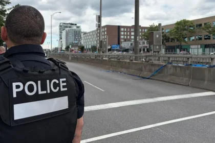 Montreal Police Shooting: Officer, Civilian, and Gunman Killed in Côte des Neiges Attack Incident in a busy neighbourhood A shooting in Montreal on Monday left three people dead, including a police officer, a civilian, and the attacker. One other officer suffered serious injuries but is now in stable condition. The violence took place in Côte des Neiges, a diverse area of the city. Witnesses reported hearing gunfire and seeing a gun pointed from a window. One local resident said he rushed to hide inside a nearby restaurant after hearing the shots and later saw the attacker moving in military style clothing. Police response and suspect details Police said the suspect acted alone and was quickly shot dead at the scene. Authorities have not confirmed a clear motive. Quebec’s public security minister said investigators are still trying to understand why the attack happened. The Royal Canadian Mounted Police also alerted police forces across Canada after reports of a document circulating online that encouraged violence against officers. Officer killed in the line of duty Montreal police identified the officer killed as 34 year old Mohamed Lamine Benredouane. He joined the force in 2021. The department said he will be remembered for his professionalism and dedication, and flags will be lowered in his honour. Police leadership described the situation as deeply traumatic, calling it one of the darkest moments for the force in recent years. Civilian victim identified The civilian killed was identified as Michael Moshe Mizrahi. He was described by community representatives as a respected member of Montreal’s Jewish community. Police have not confirmed that the attack was targeted or motivated by antisemitism. Ongoing investigation Authorities continue to investigate the circumstances surrounding the shooting, including the suspect’s background and possible motives. Officials say more details will be released as the inquiry develops.